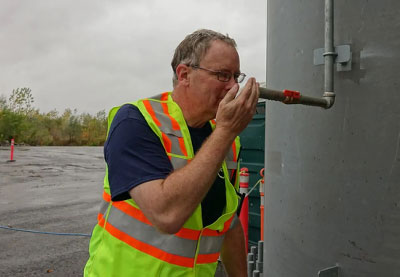 ottowa-composting-facility-1 ottowa composting facility man inspecting a pipe
