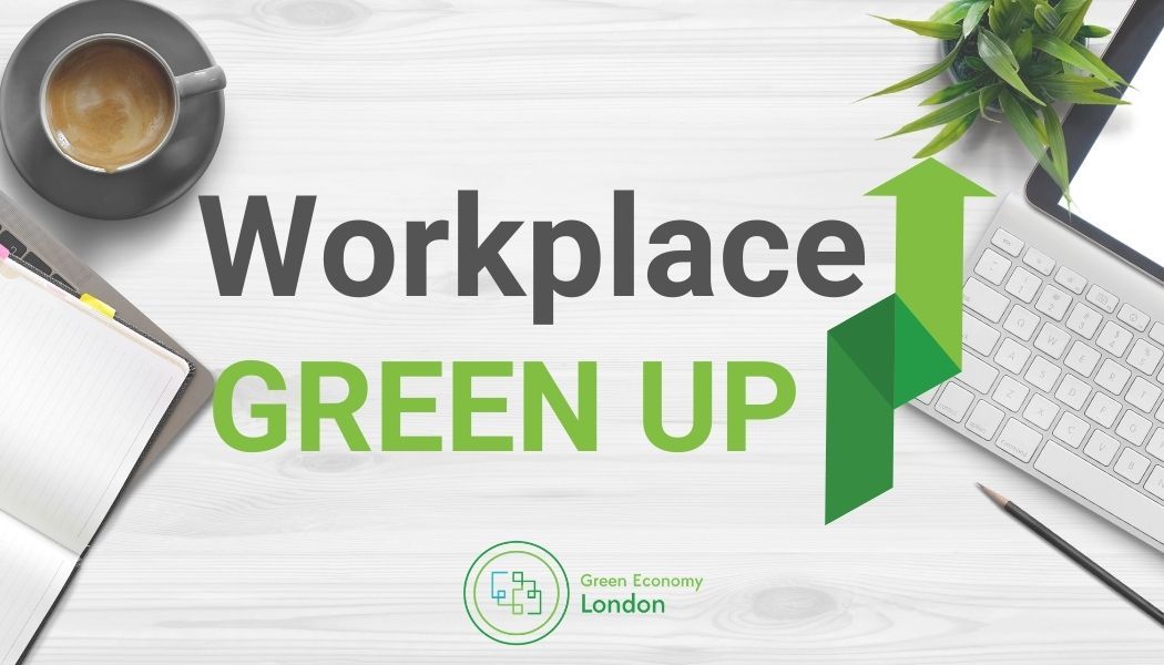 Workplace Green up logo on a computer desk.