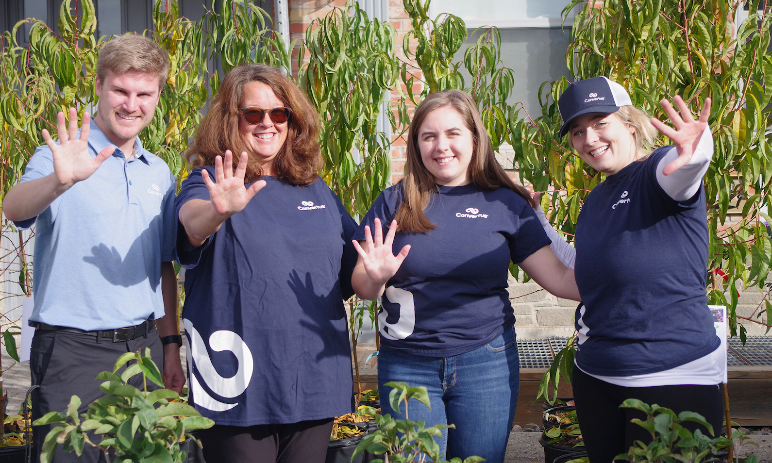 Fruit Tree Giveaway team from Convertus waving.